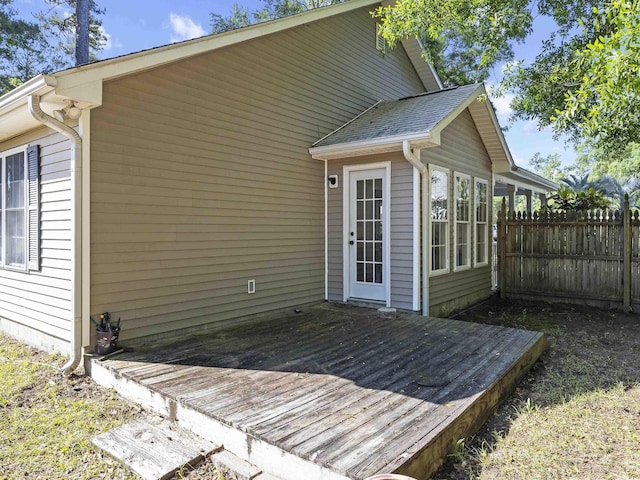 exterior space featuring fence and a deck