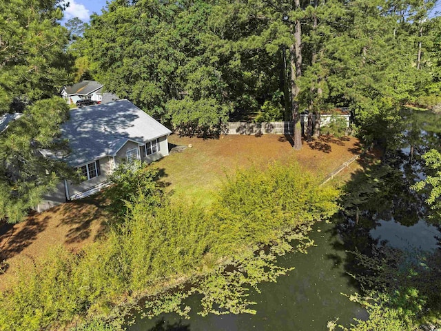 aerial view featuring a water view and a forest view