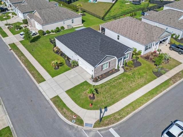 birds eye view of property with a residential view