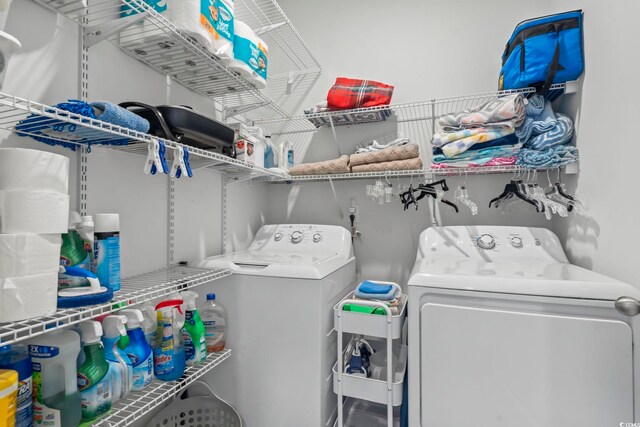 clothes washing area with laundry area and washing machine and dryer