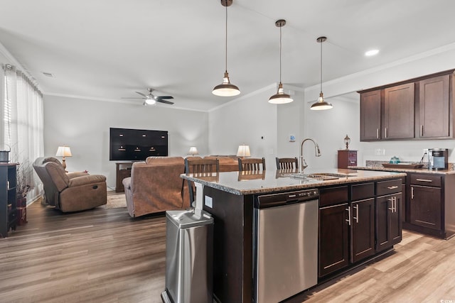 kitchen with ceiling fan, crown molding, dishwasher, a sink, and light wood-style floors