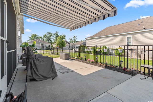 view of patio featuring fence and a residential view