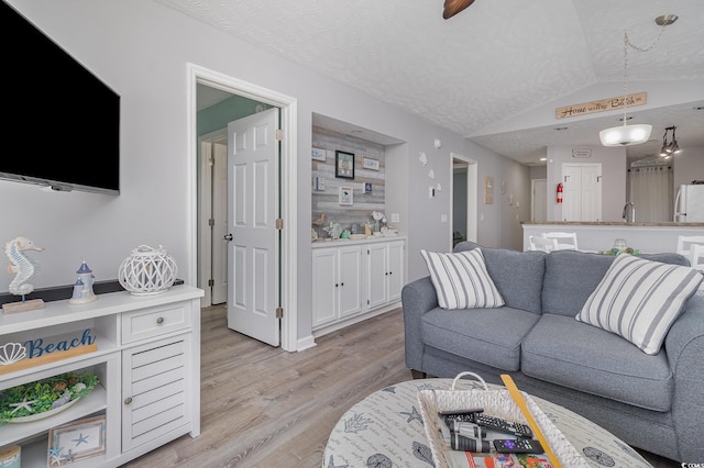 673 Tupelo Ln Unit G, Longs, SC 29568 - living area with vaulted ceiling and light wood-style flooring
