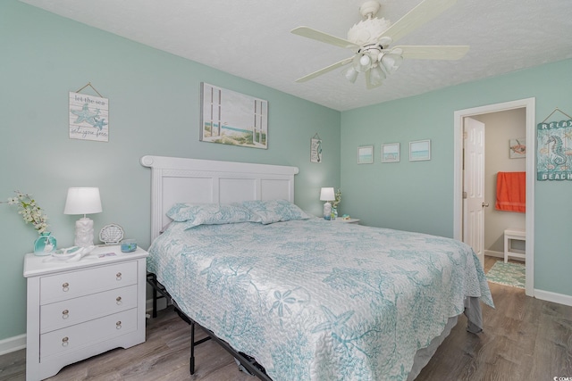 bedroom with baseboards, a ceiling fan, and wood finished floors