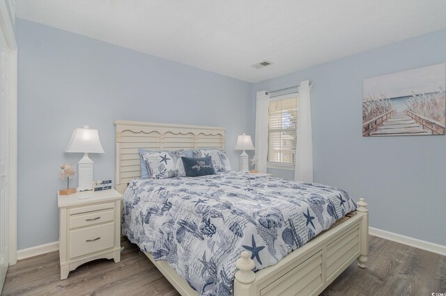 673 Tupelo Ln Unit G, Longs, SC 29568 - bedroom with wood finished floors and baseboards