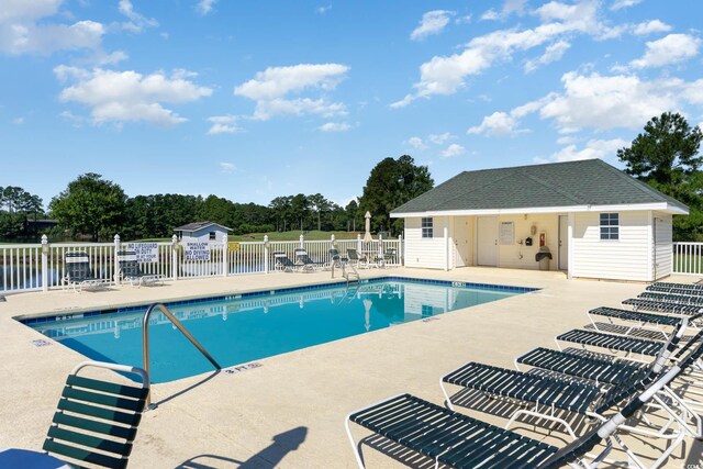 673 Tupelo Ln Unit G, Longs, SC 29568 - community pool with a patio and fence