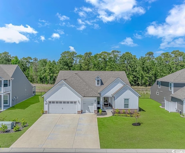 view of front of property with a garage, a front lawn, board and batten siding, and concrete driveway