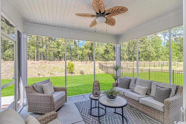 sunroom / solarium with a ceiling fan and an outdoor hangout area