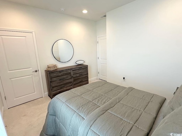 bedroom with recessed lighting, baseboards, visible vents, and light carpet