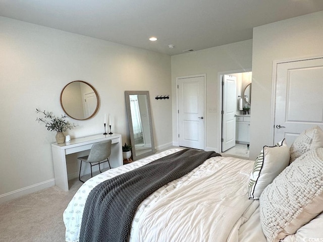 bedroom with baseboards, recessed lighting, and light carpet