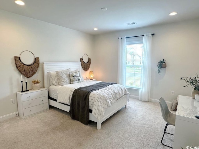 bedroom featuring recessed lighting, baseboards, and light carpet