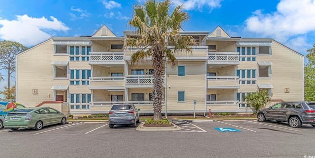 1100 Possum Trot Rd Unit H136, North Myrtle Beach, SC 29582 - view of building exterior with uncovered parking