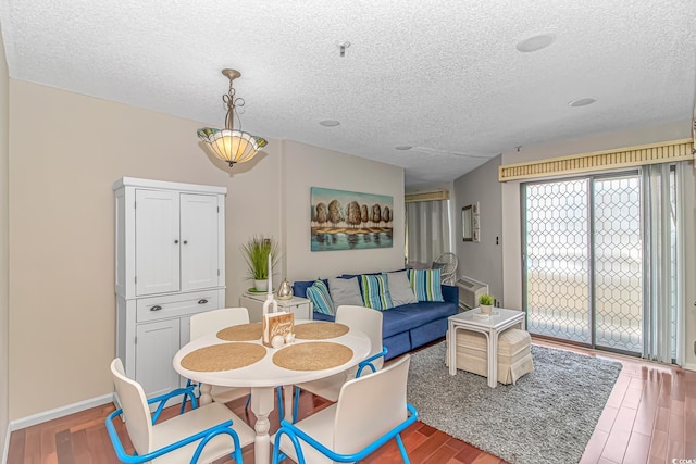 1100 Possum Trot Rd Unit H136, North Myrtle Beach, SC 29582 - dining room with a textured ceiling and wood finished floors