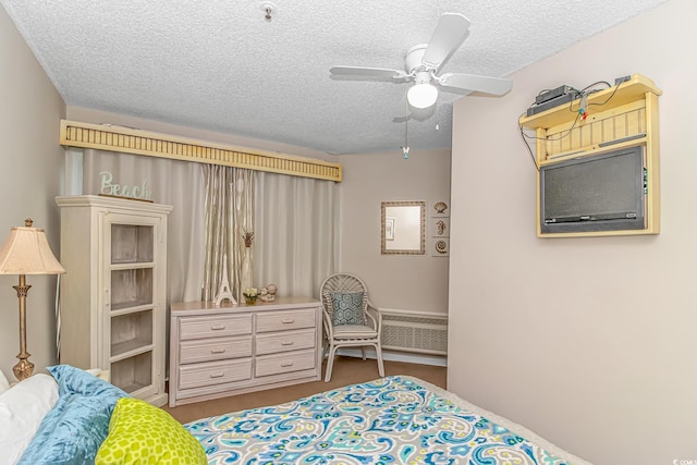 1100 Possum Trot Rd Unit H136, North Myrtle Beach, SC 29582 - carpeted bedroom with a textured ceiling and ceiling fan