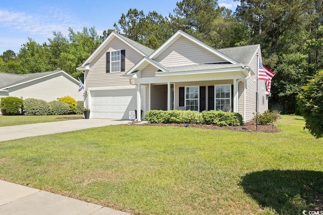680 Twinflower St, Little River, SC 29566 - traditional-style home featuring driveway, an attached garage, a front yard, a porch, and roof with shingles