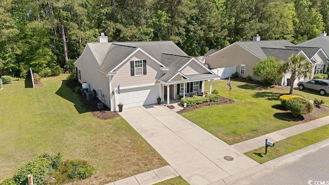 680 Twinflower St, Little River, SC 29566 - view of front of home featuring an attached garage, a chimney, a front yard, a porch, and driveway