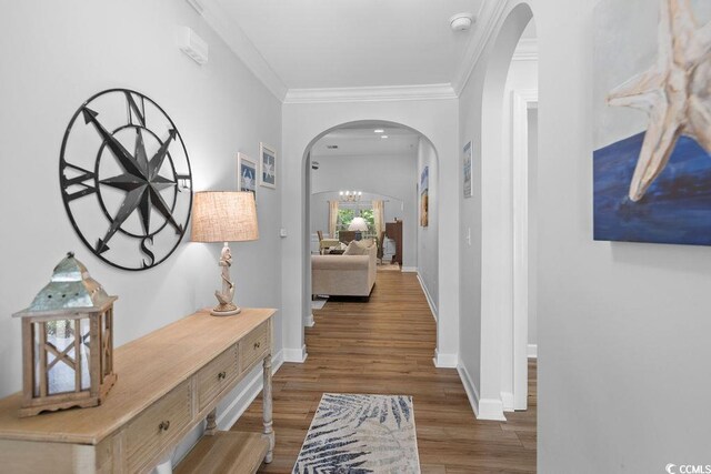 680 Twinflower St, Little River, SC 29566 - hallway featuring ornamental molding, arched walkways, baseboards, and wood finished floors