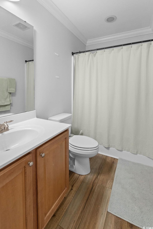 680 Twinflower St, Little River, SC 29566 - full bath with toilet, ornamental molding, visible vents, vanity, and wood finished floors