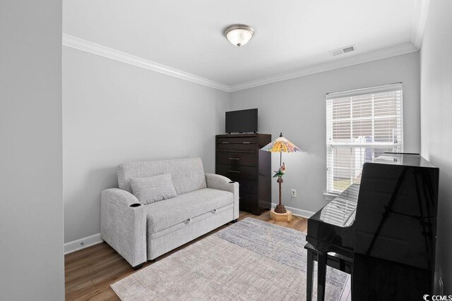 680 Twinflower St, Little River, SC 29566 - sitting room featuring baseboards, ornamental molding, visible vents, and wood finished floors