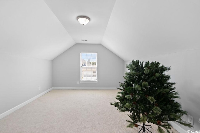 680 Twinflower St, Little River, SC 29566 - bonus room featuring baseboards, lofted ceiling, and carpet floors