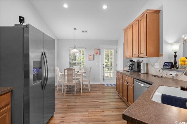 680 Twinflower St, Little River, SC 29566 - kitchen featuring light wood-type flooring, stainless steel appliances, dark countertops, and visible vents