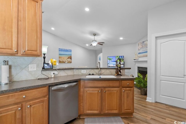 680 Twinflower St, Little River, SC 29566 - kitchen featuring a sink, lofted ceiling, tasteful backsplash, dishwasher, and light wood-style floors