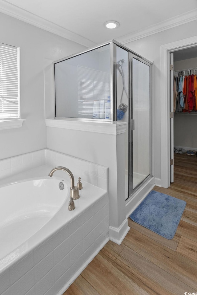 680 Twinflower St, Little River, SC 29566 - bathroom featuring ornamental molding, a garden tub, a shower stall, and wood finished floors