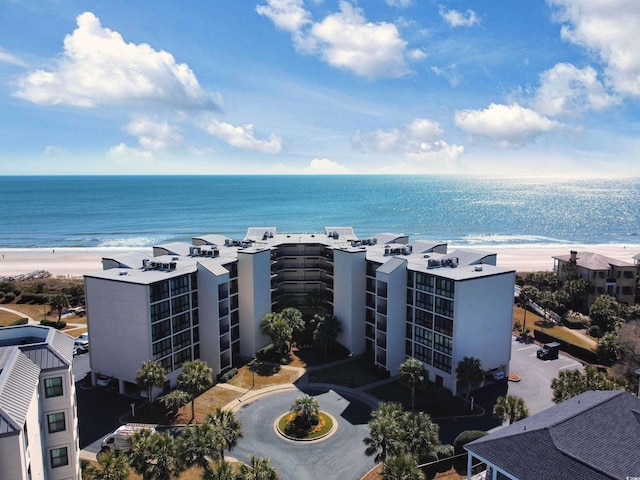 birds eye view of property featuring a water view and a view of the beach