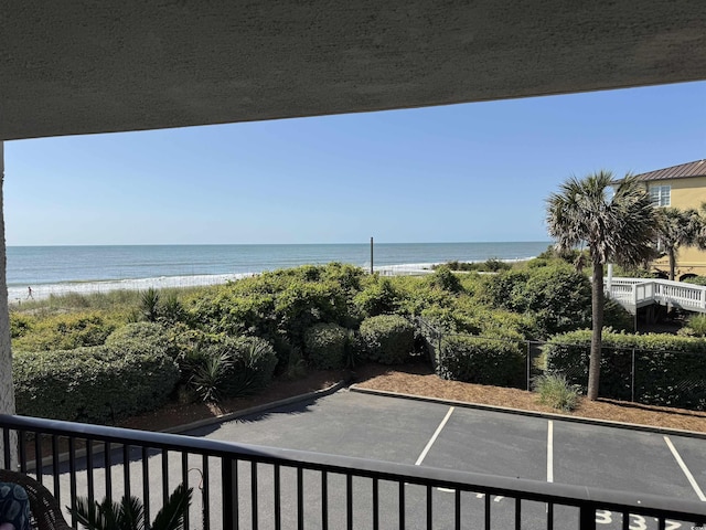exterior space featuring a view of the beach and a water view