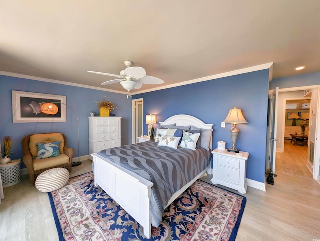 bedroom with baseboards, ornamental molding, light wood finished floors, and a ceiling fan