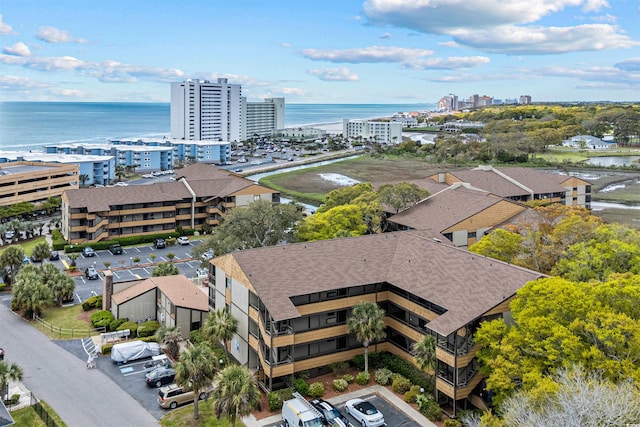 bird's eye view featuring a water view and a city view