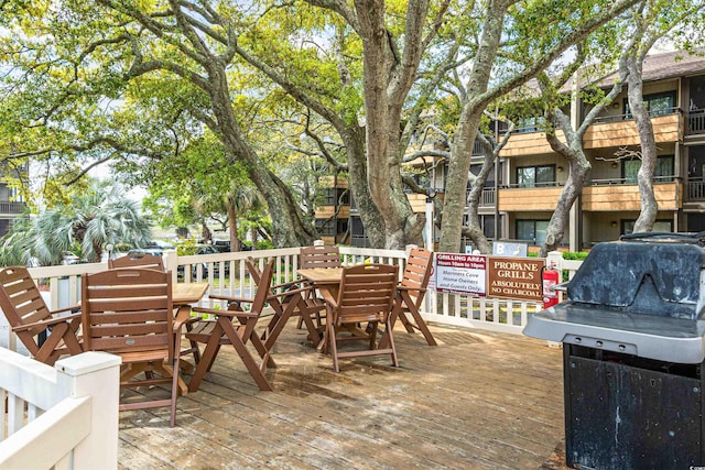 view of patio / terrace featuring a wooden deck and outdoor dining space