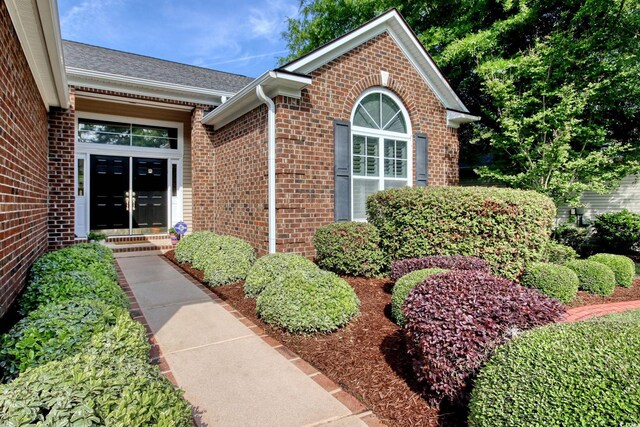 78 Saltwind Loop, Murrells Inlet, SC 29576 - property entrance with brick siding, french doors, and roof with shingles