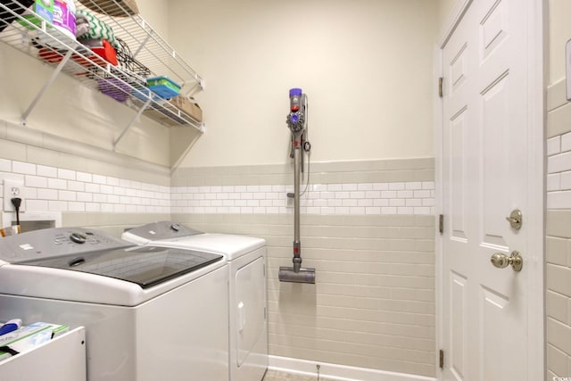 78 Saltwind Loop, Murrells Inlet, SC 29576 - laundry room with washer and dryer, laundry area, tile walls, and a wainscoted wall