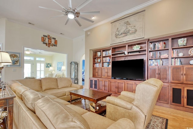 78 Saltwind Loop, Murrells Inlet, SC 29576 - living area featuring crown molding, visible vents, light wood-style floors, ceiling fan, and arched walkways