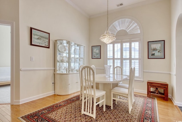 78 Saltwind Loop, Murrells Inlet, SC 29576 - dining area featuring an inviting chandelier, crown molding, visible vents, light wood-style floors, and baseboards