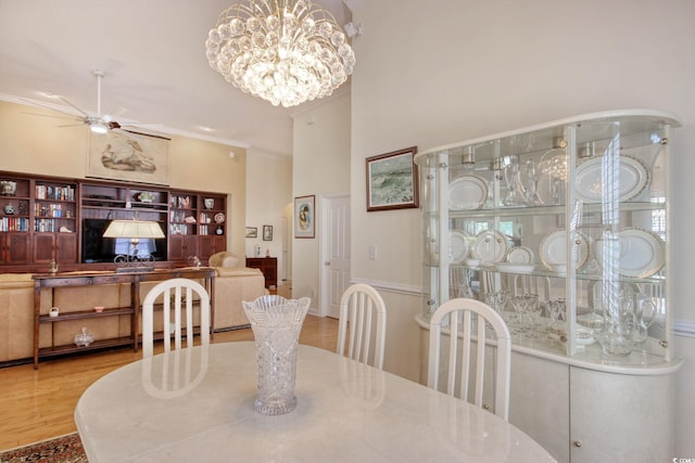 78 Saltwind Loop, Murrells Inlet, SC 29576 - dining area with ornamental molding, ceiling fan with notable chandelier, and wood finished floors