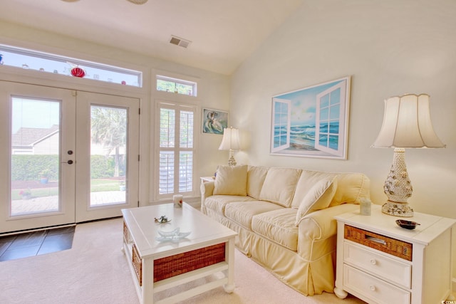 78 Saltwind Loop, Murrells Inlet, SC 29576 - living room featuring vaulted ceiling, french doors, light tile patterned flooring, and visible vents