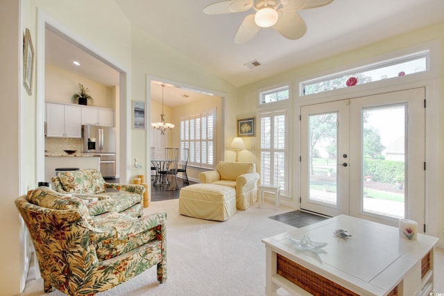 78 Saltwind Loop, Murrells Inlet, SC 29576 - living room featuring visible vents, lofted ceiling, light colored carpet, french doors, and ceiling fan with notable chandelier