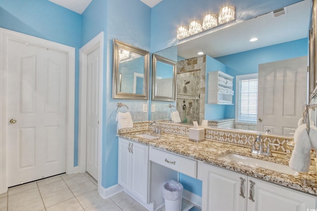 78 Saltwind Loop, Murrells Inlet, SC 29576 - bathroom with a sink, tile patterned flooring, a tile shower, and visible vents