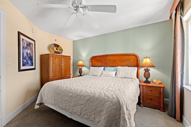 bedroom with carpet floors, a textured ceiling, and baseboards