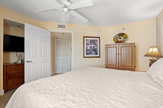 215 77th Ave N Unit 807, Myrtle Beach, SC 29572 - bedroom with ceiling fan, visible vents, and carpet