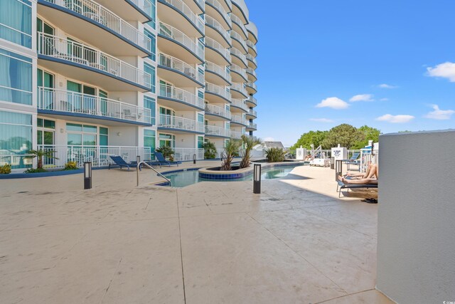 215 77th Ave N Unit 807, Myrtle Beach, SC 29572 - view of community featuring a patio and a pool