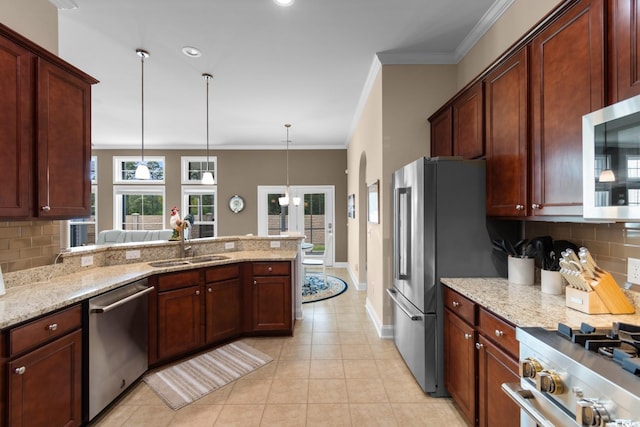 kitchen featuring a sink, appliances with stainless steel finishes, light tile patterned floors, and tasteful backsplash