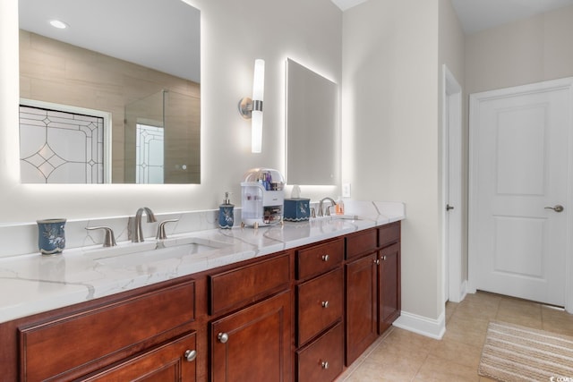 bathroom featuring a sink, tile patterned floors, an enclosed shower, and double vanity
