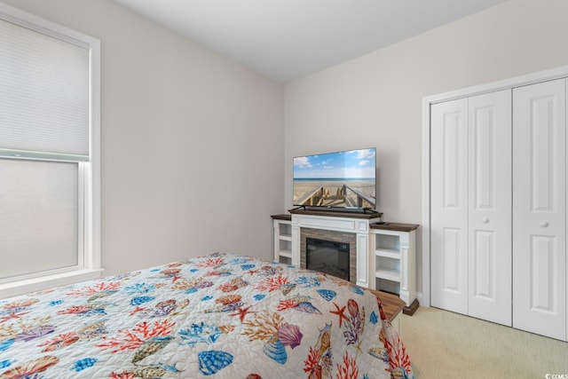 carpeted bedroom with a closet