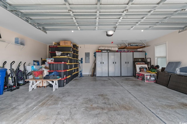 garage featuring a garage door opener and electric panel