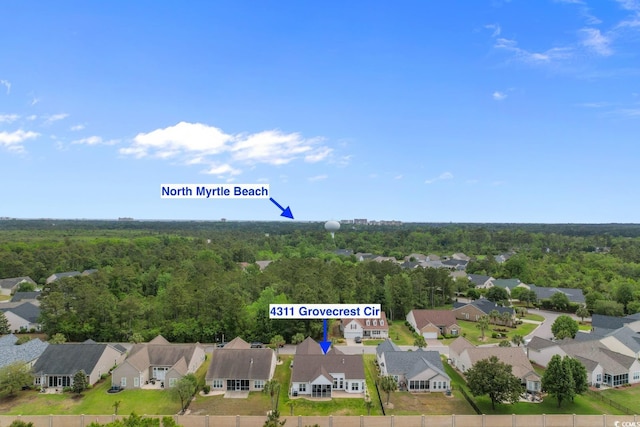 aerial view featuring a residential view and a view of trees