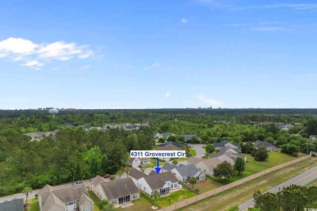drone / aerial view with a view of trees and a residential view
