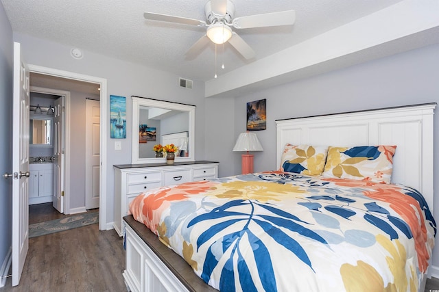 bedroom with visible vents, a textured ceiling, ceiling fan, and dark wood-style floors